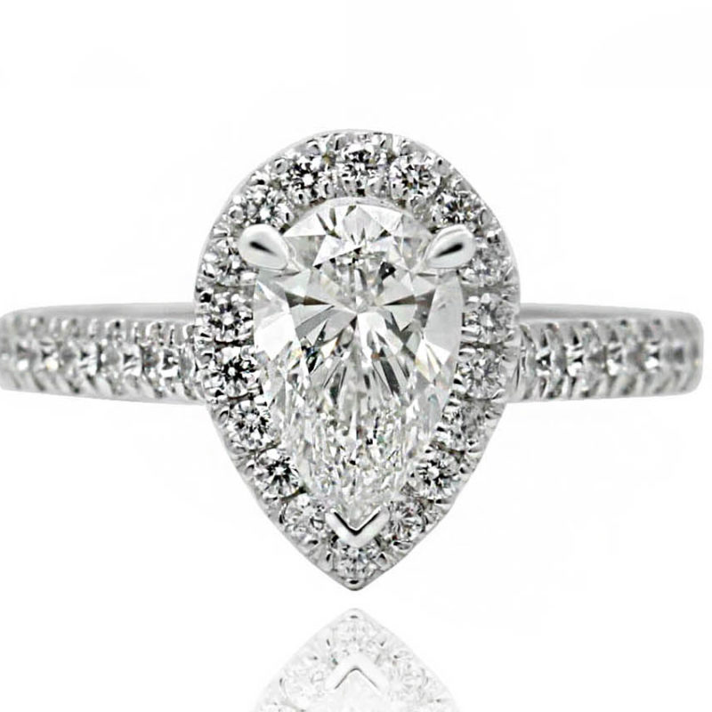 Pear shape engagement ring with diamonds and white gold