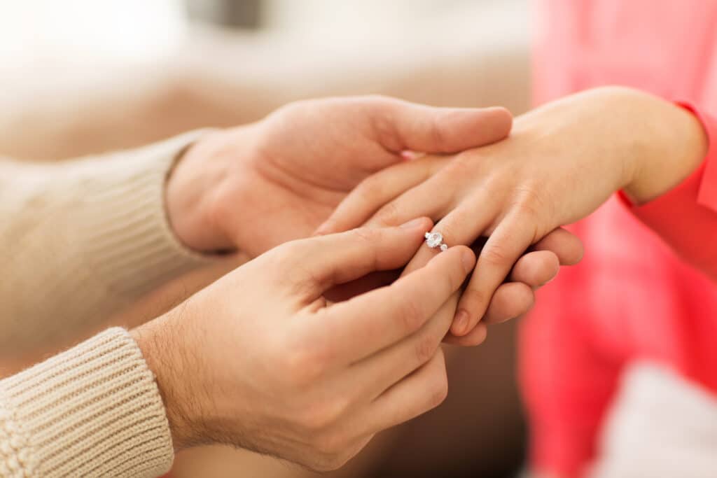 man giving diamond ring to woman on valentines day